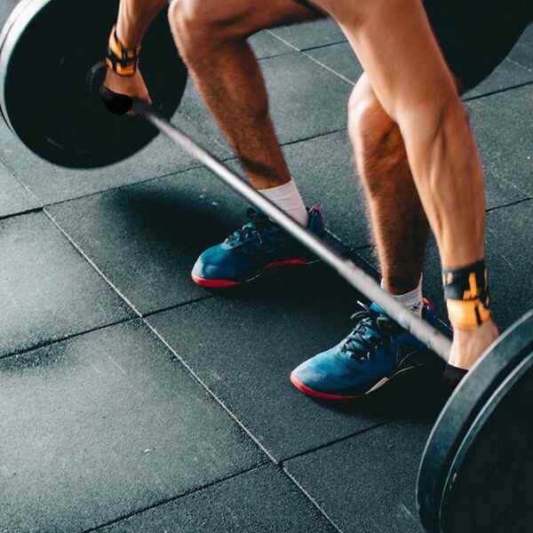 An adult stretching in a calm indoor setting
